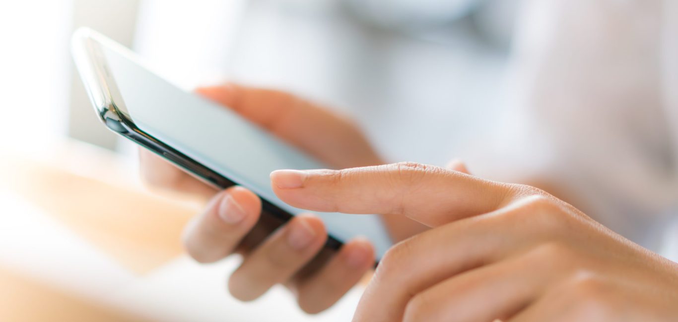 Business hand with mobile phone